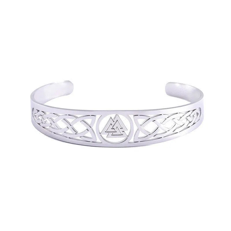 Handcrafted stainless steel bracelet with Valknut symbol and Celtic design on a neutral background