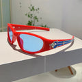 Black frame sports sunglasses with blue polycarbonate lenses on a wooden surface.