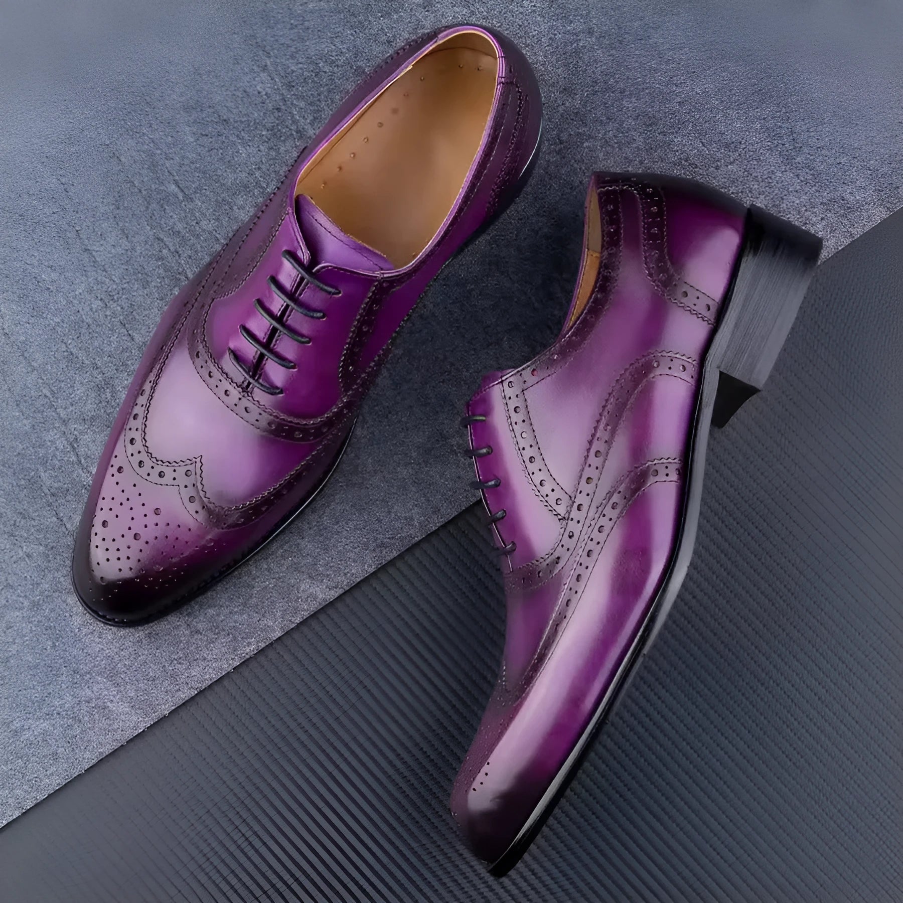 Men's purple Oxford shoes with hand carved detailing and pointed toe style on rubber sole