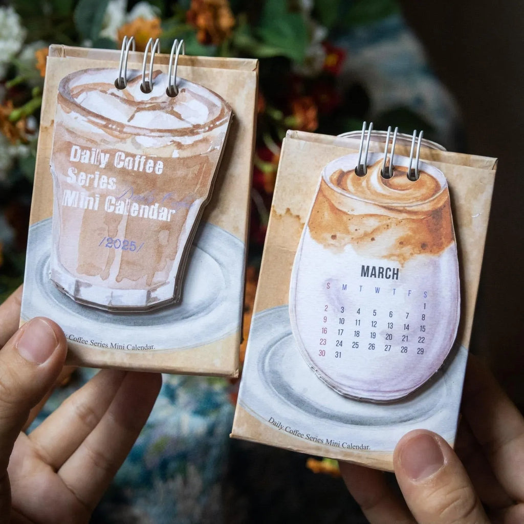 Four mini paper desk calendars for 2025 with different motivational themes in simple modern design