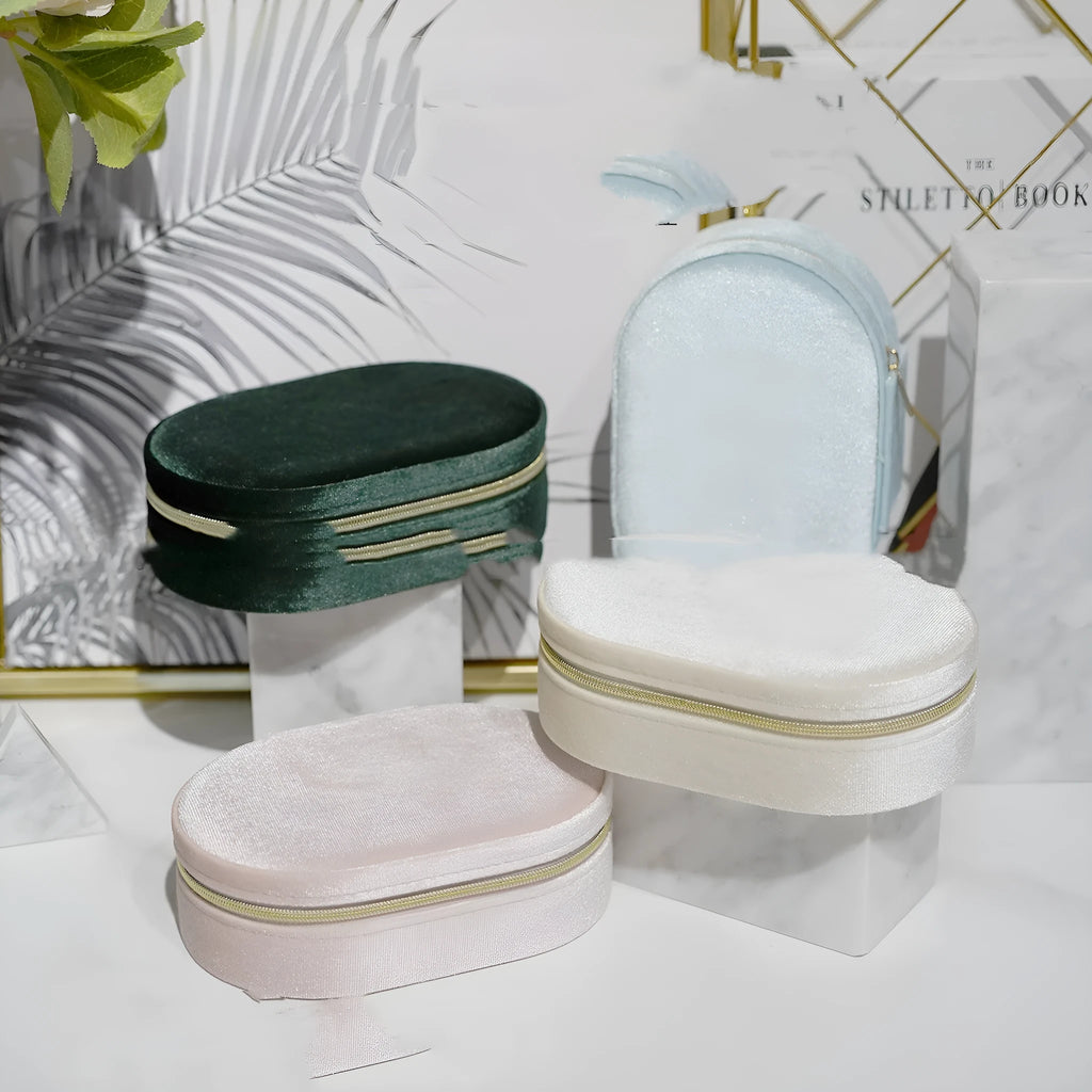 Korean style oval velvet jewellery storage box in assorted colours with flannel lining.