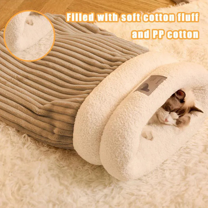 Brown semi-enclosed lambswool cat sleeping bag on a wooden floor.
