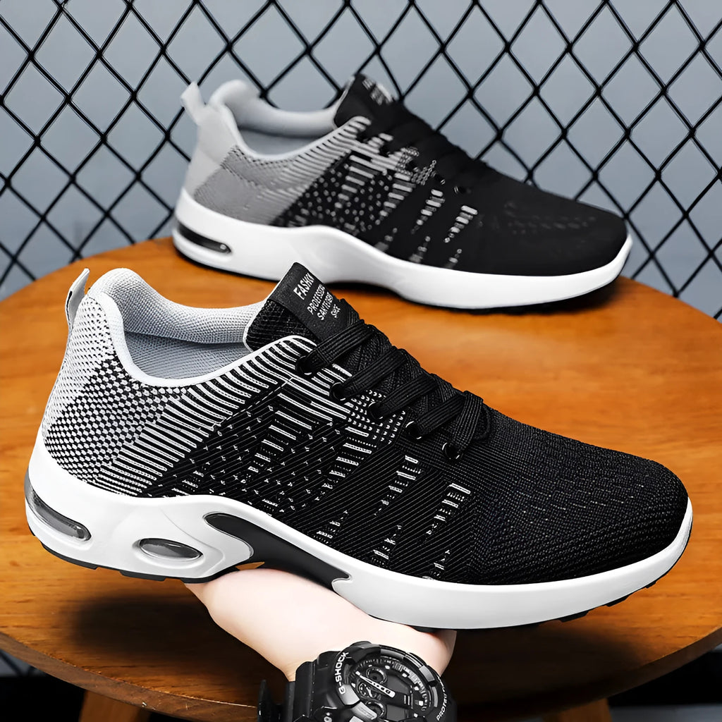 Men's low-top Flyknit mesh sneakers in black and blue colour, showcasing the lace-up design and round toe.