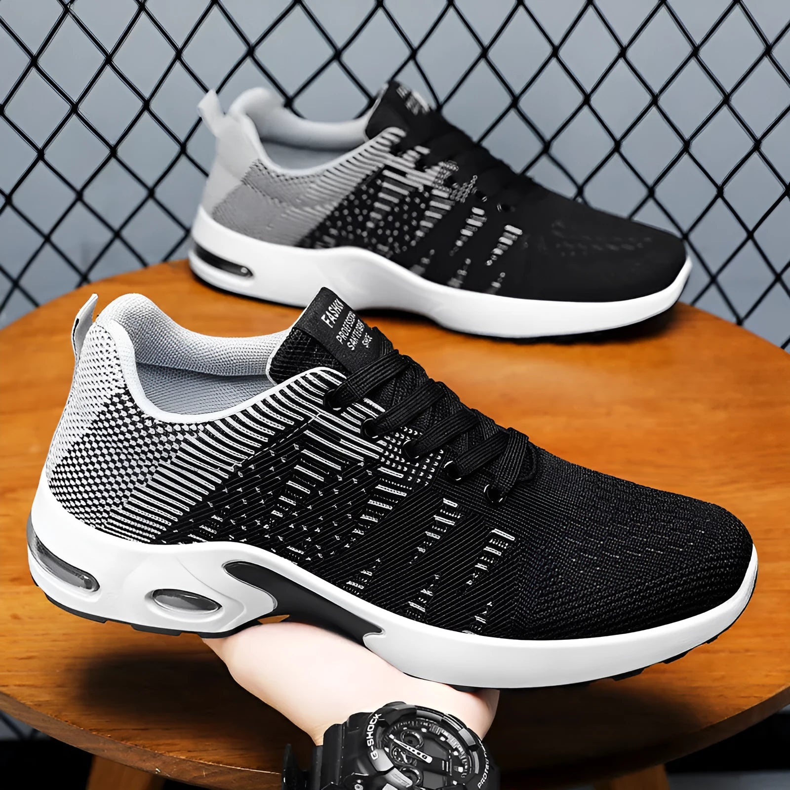 Men's low-top Flyknit mesh sneakers in black and blue colour, showcasing the lace-up design and round toe.