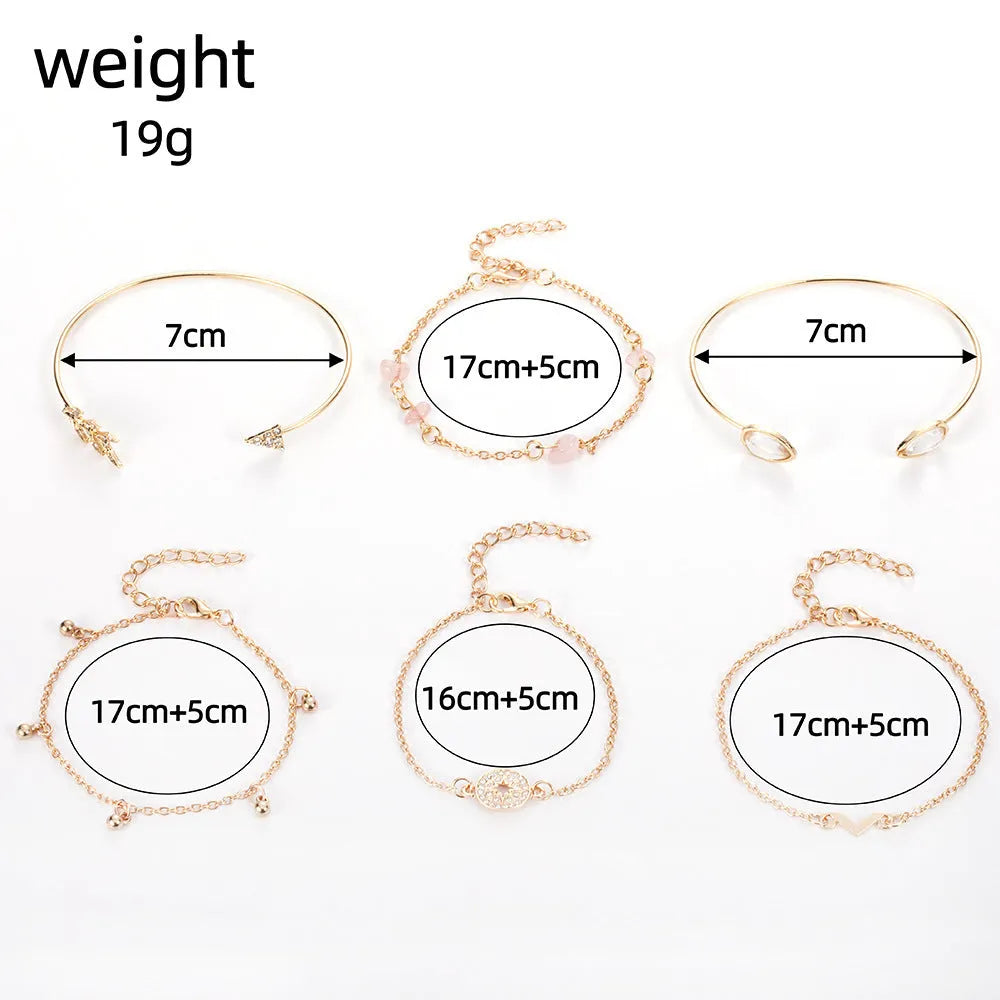 Gold zinc alloy bracelet set with water droplet and V-shaped designs for women.