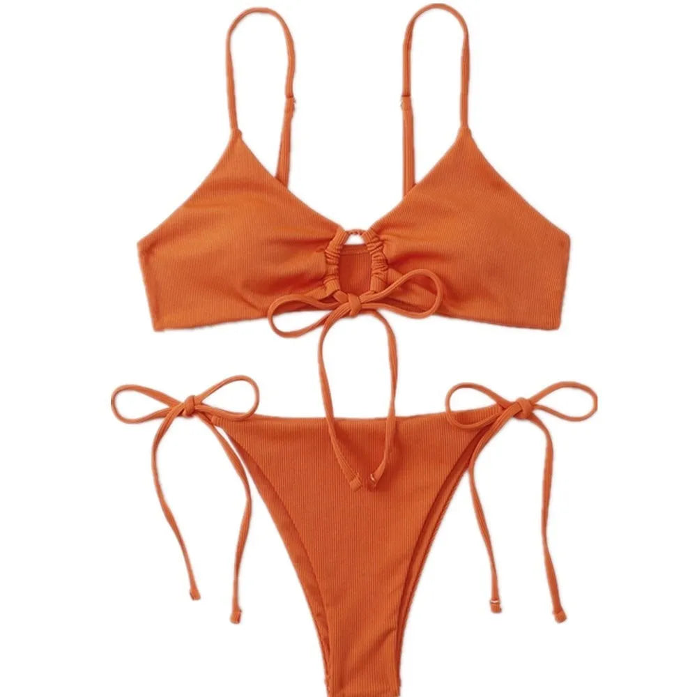 Women's solid colour drawstring bikini set in brief backless style on a neutral background.