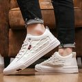 Men's white lace-up casual sneakers with round toe and flat rubber sole.