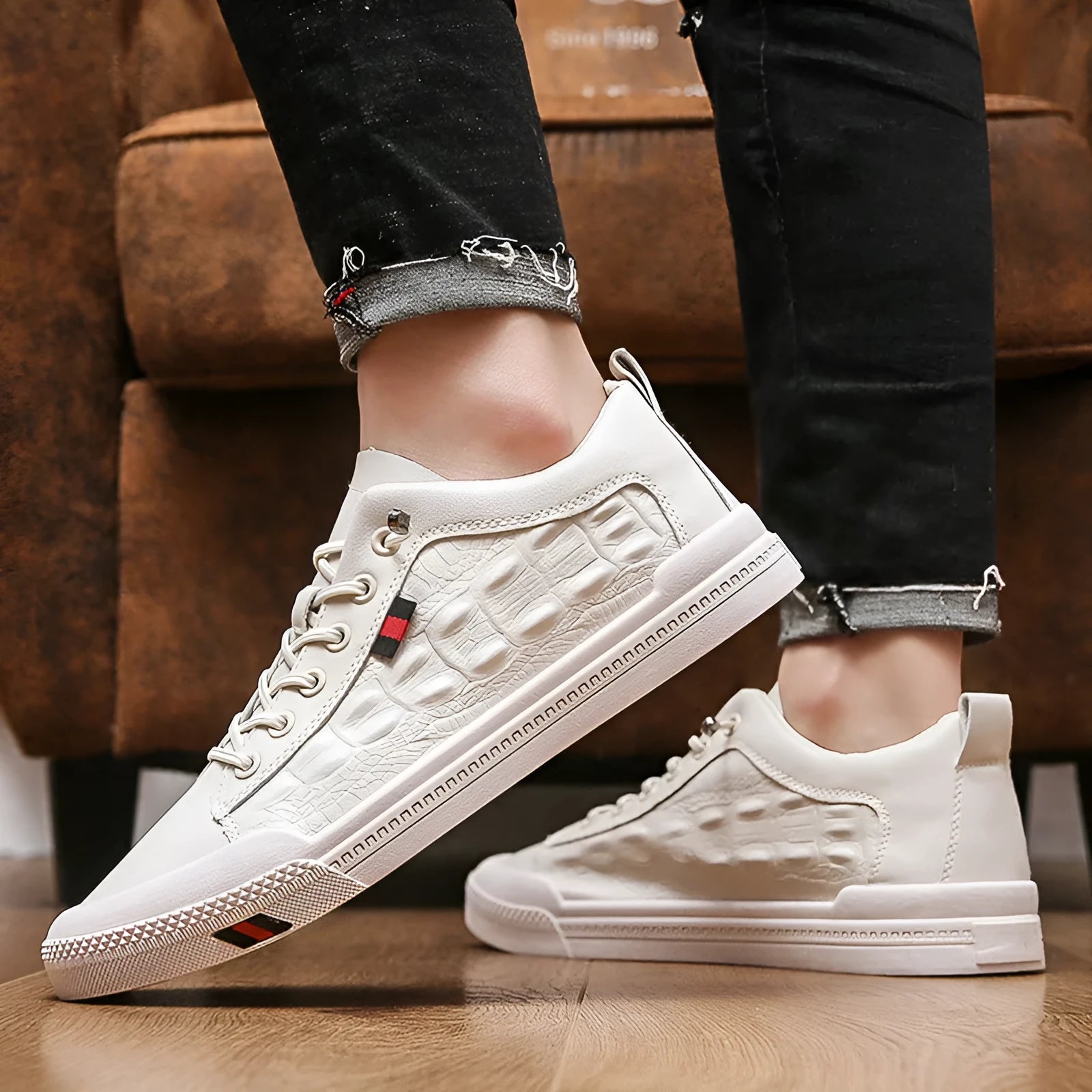 Men's white lace-up casual sneakers with round toe and flat rubber sole.