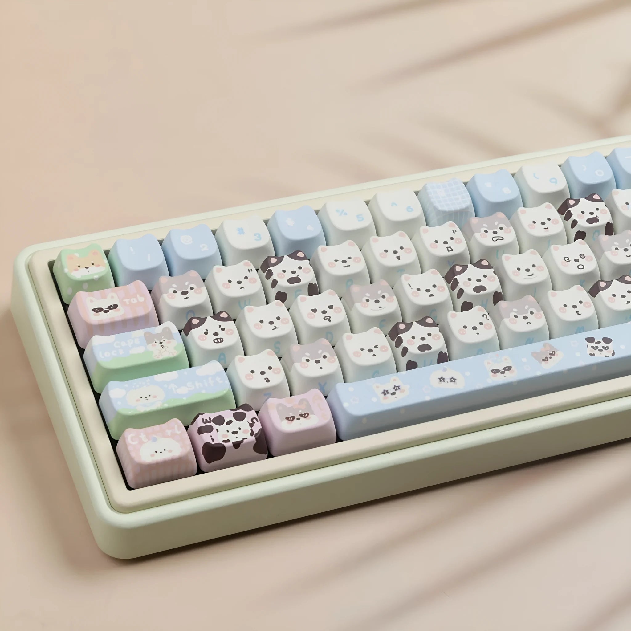 Colourful PBT key cap set for mechanical keyboards with printed cat and puppy designs.