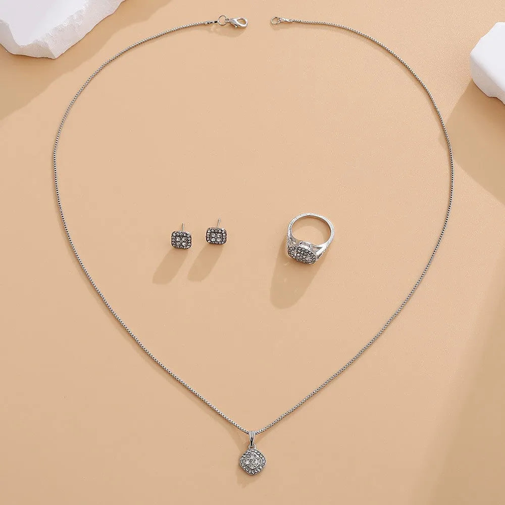 Alloy rhinestone three-piece wedding set with ring, stud earrings and 67cm necklace in gold