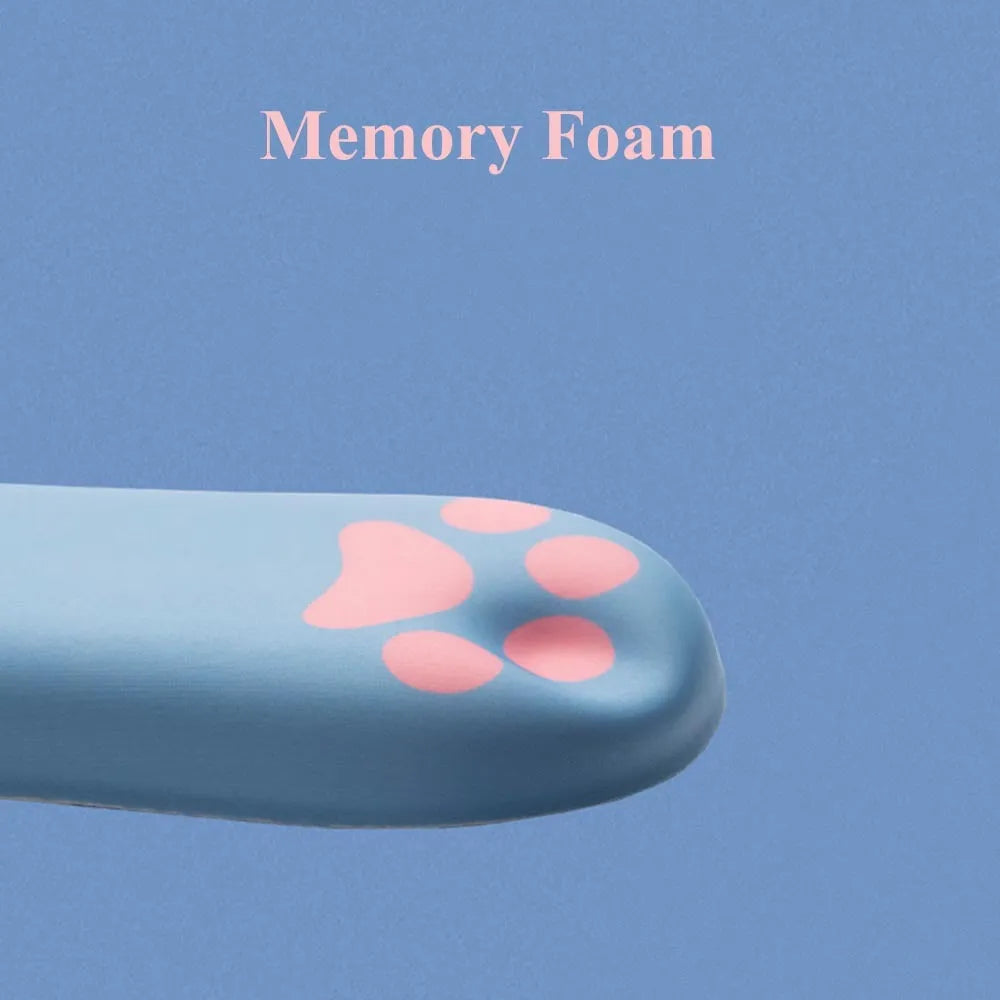 Cat's claw shaped memory foam wrist support pad in black, placed in front of a keyboard.