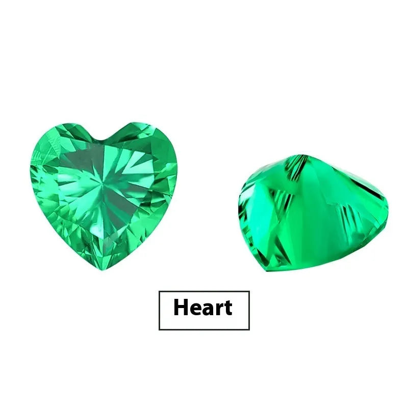 A loose cultivated emerald gemstone in a columbia green treasure colour on a white background.
