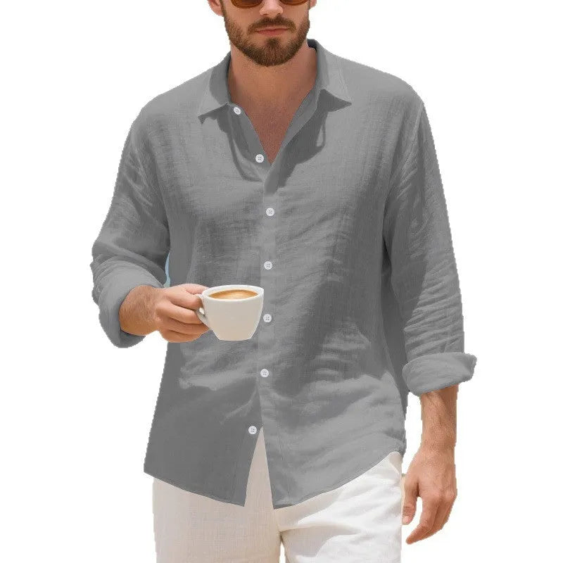 Man wearing a loose-fit light blue linen casual shirt with a non-iron finish, buttoned front, and classic collar.