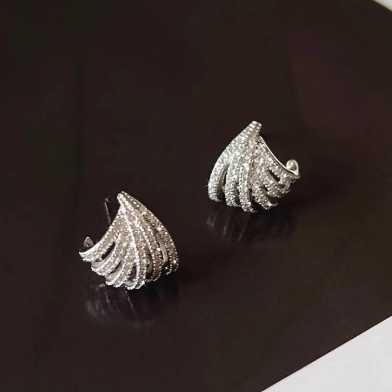 Geometric zircon earrings for women with a platinum electroplated finish.