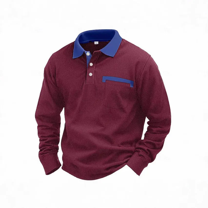 Man wearing a long-sleeved waffle-knit polo shirt in a solid colour with a loose, asymmetric retro fit.
