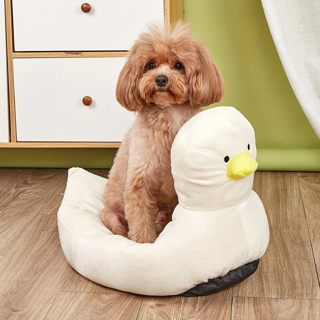 Blue duck-shaped fluffy pet bed for a small dog, showing raised rim and soft material.