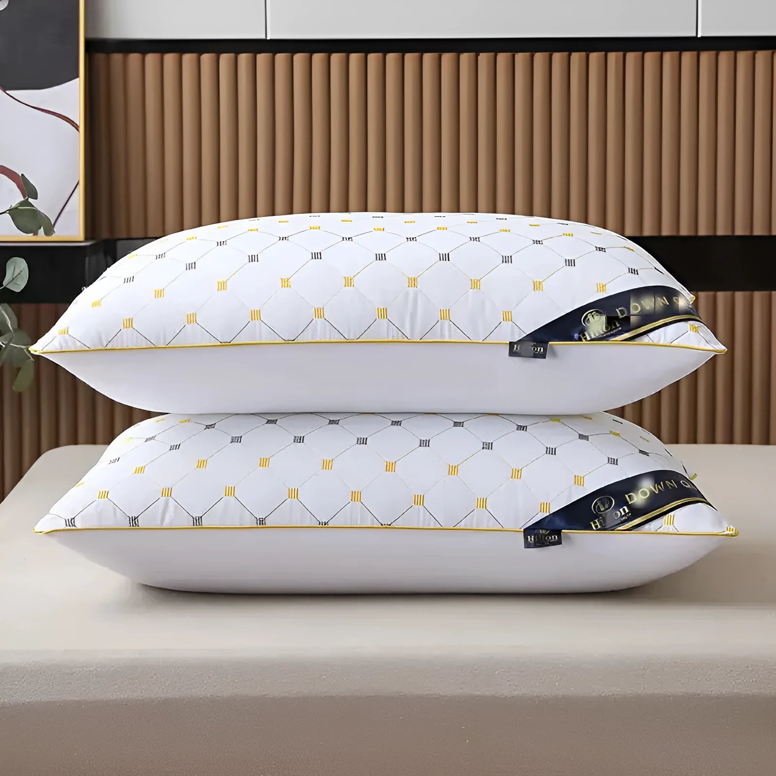 A white chemical fibre bedding pillow with a polyester shell, shown next to a blue argy wormwood patterned variant.