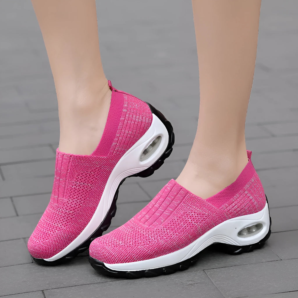 Women's mesh slip on air cushion sneakers in black, with low top and thick bottom, side view