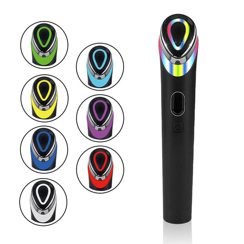 Black 7 colour light vibration eye and face massager on a dark background.