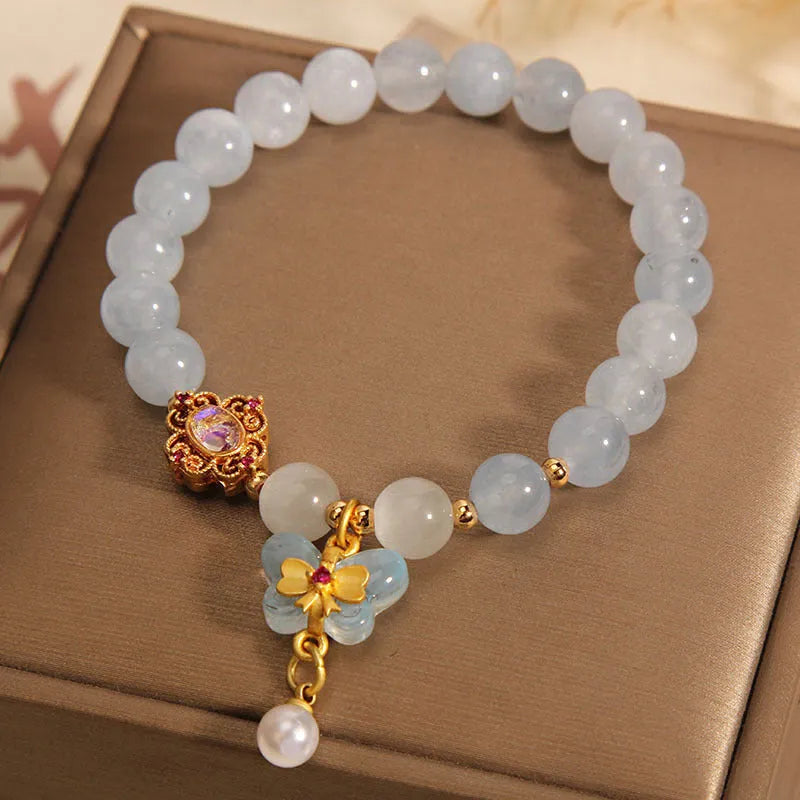 Women's crystal bracelet with butterfly pendant and aquamarine rhinestones