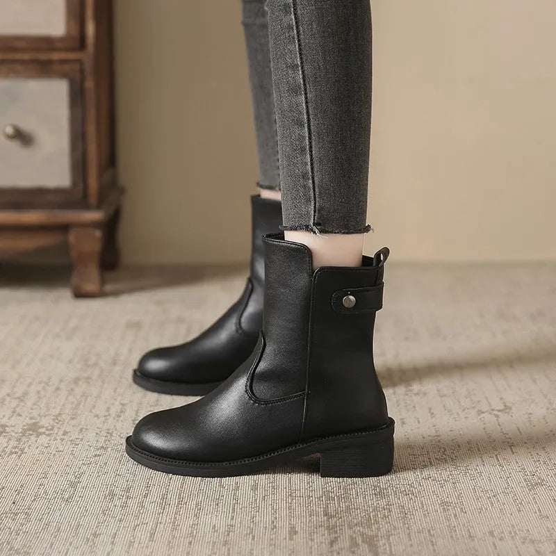 Black women's ankle boots with side zip and low round toe on rubber sole