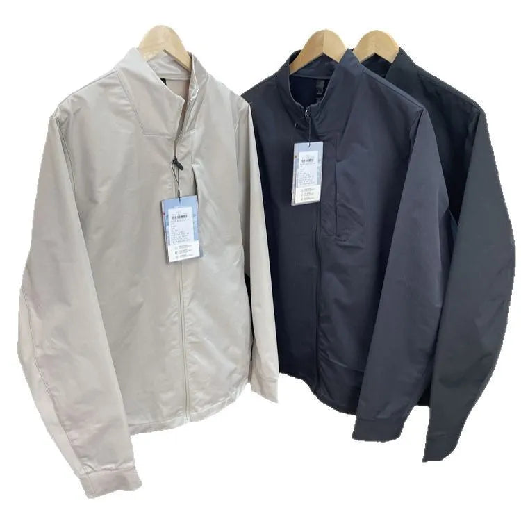 Men's stand collar casual jacket in polyester, shown in black, dark blue, or milky white.