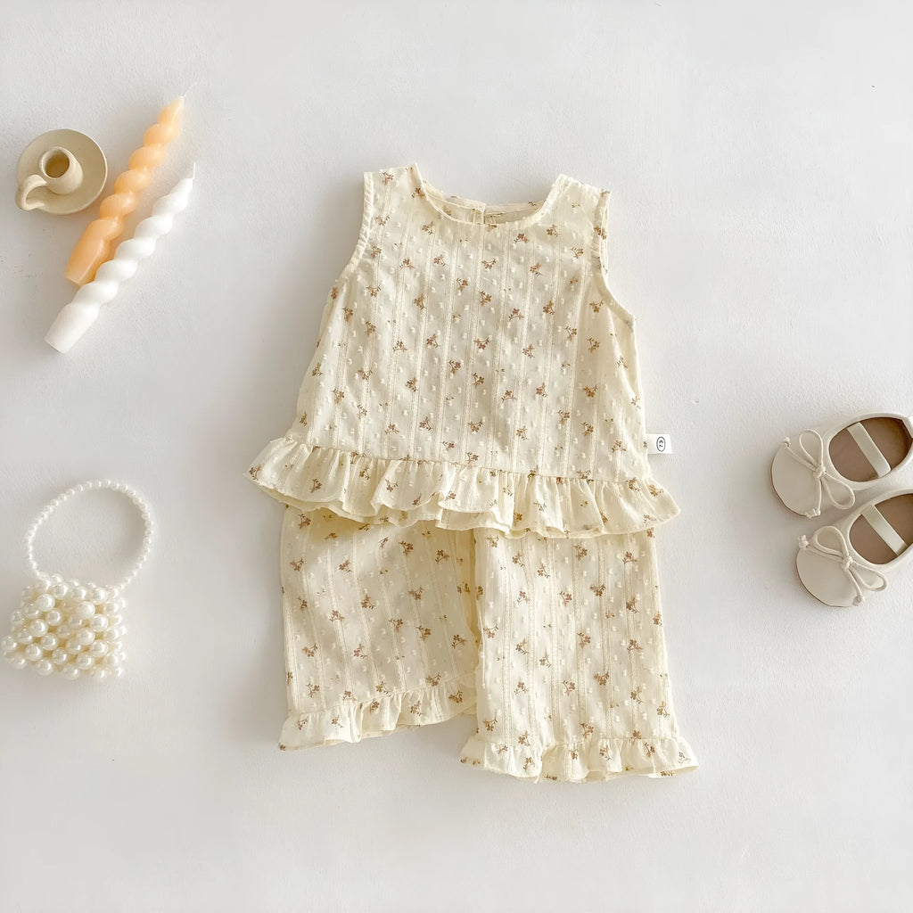 Children's cotton sleeveless top and trousers two-piece set in cream apricot on white background