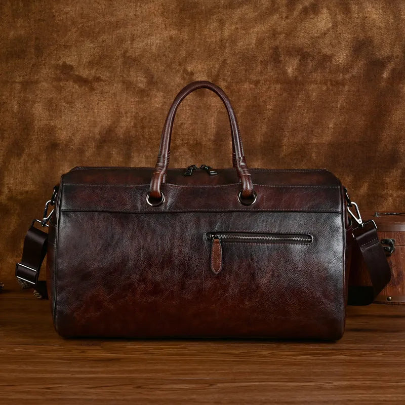 Handmade retro leather bag in vintage brown with 20L capacity and genuine leather construction