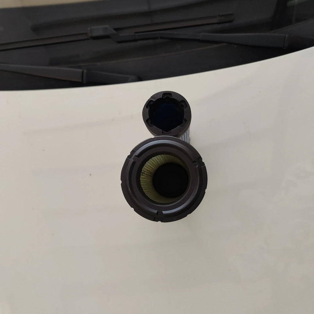 Model 1027 engine air filter with P821575 straight head and P822858 elbow, showing folded filter element.