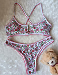 Women's V-neck swimsuit with embroidered detail and floral printed pattern in briefs style