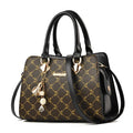 Women's geometric pattern PU leather messenger bag with zipper closure showing internal card slot and phone pocket.