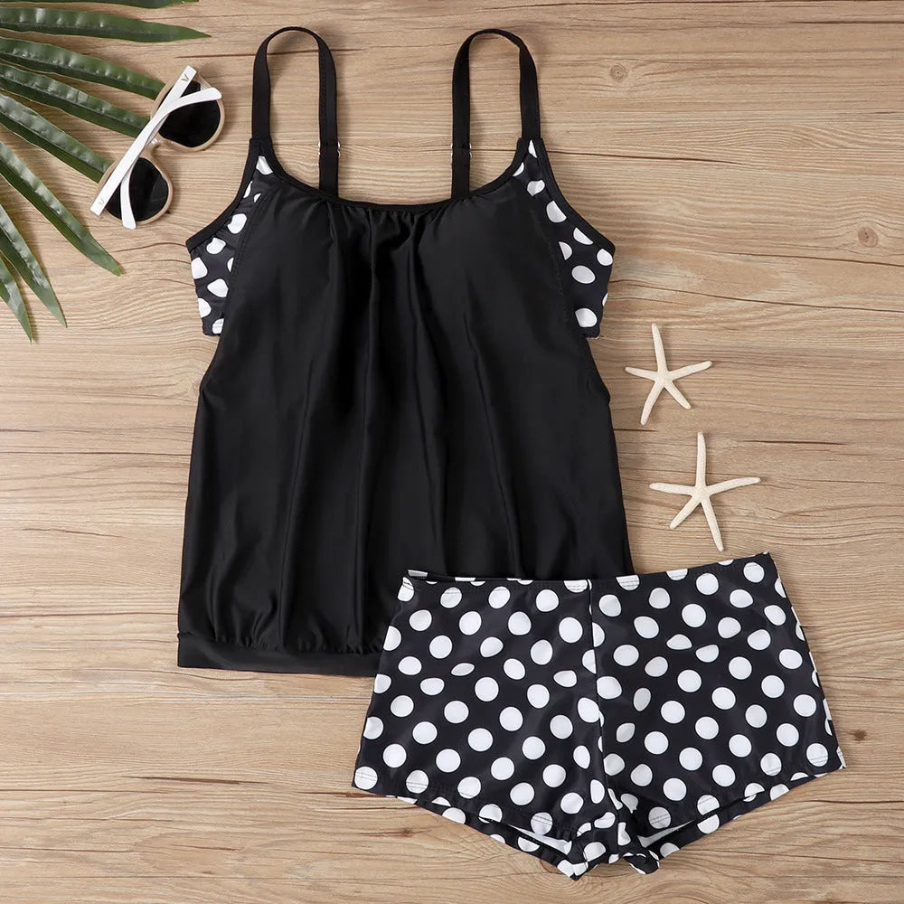 Women's black polka dot high-waist boxer swimsuit made of polyester fabric.