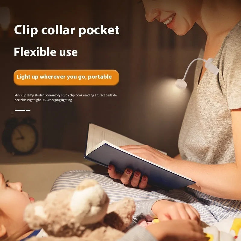 White plastic rechargeable LED book clip light clipped onto a book with USB charging cable