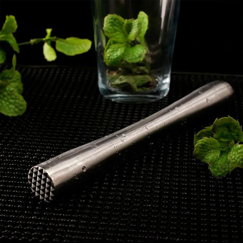 Stainless steel ice crushing hammer with 25cm straight body on a wooden bar surface