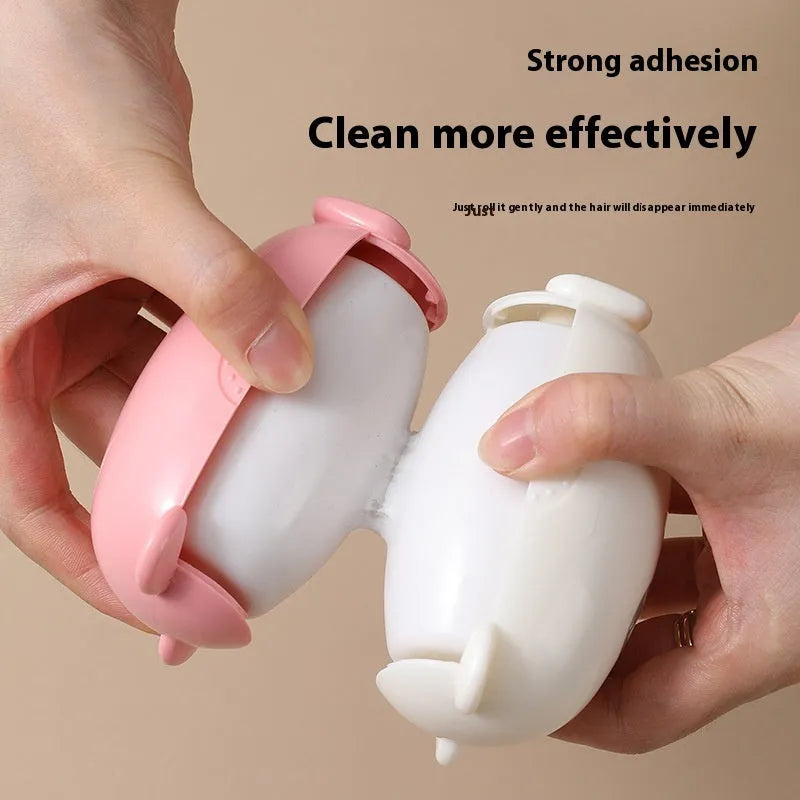 Green sticky lint remover roller with a modern plastic handle on a fabric background.