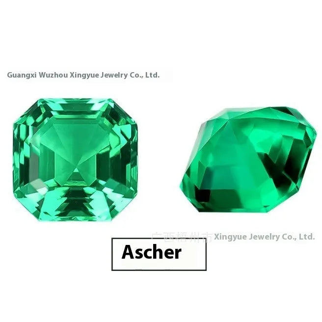 A loose cultivated emerald gemstone in a columbia green treasure colour on a white background.