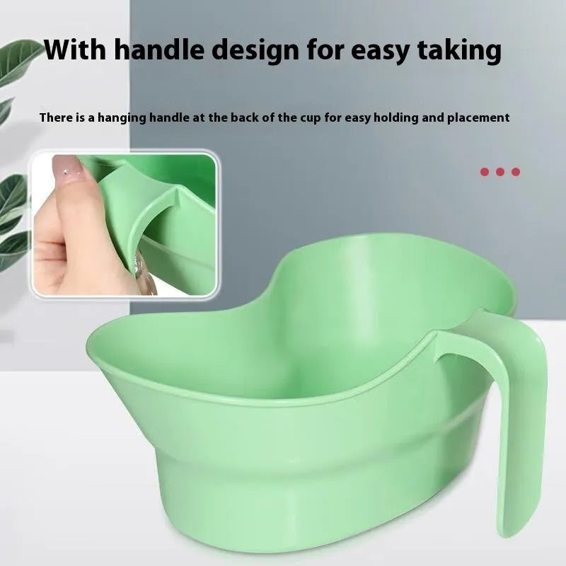 Green plastic medical gargle cup with swivel cover for bedridden patient oral care.