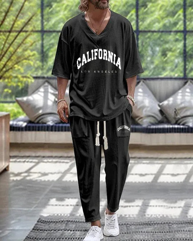 Lightweight cropped sleeve V-neck top and matching trousers suit in a solid colour.