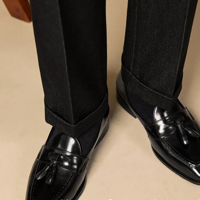 Men's polished leather tassel loafers in black and brown with pigskin lining and rubber sole