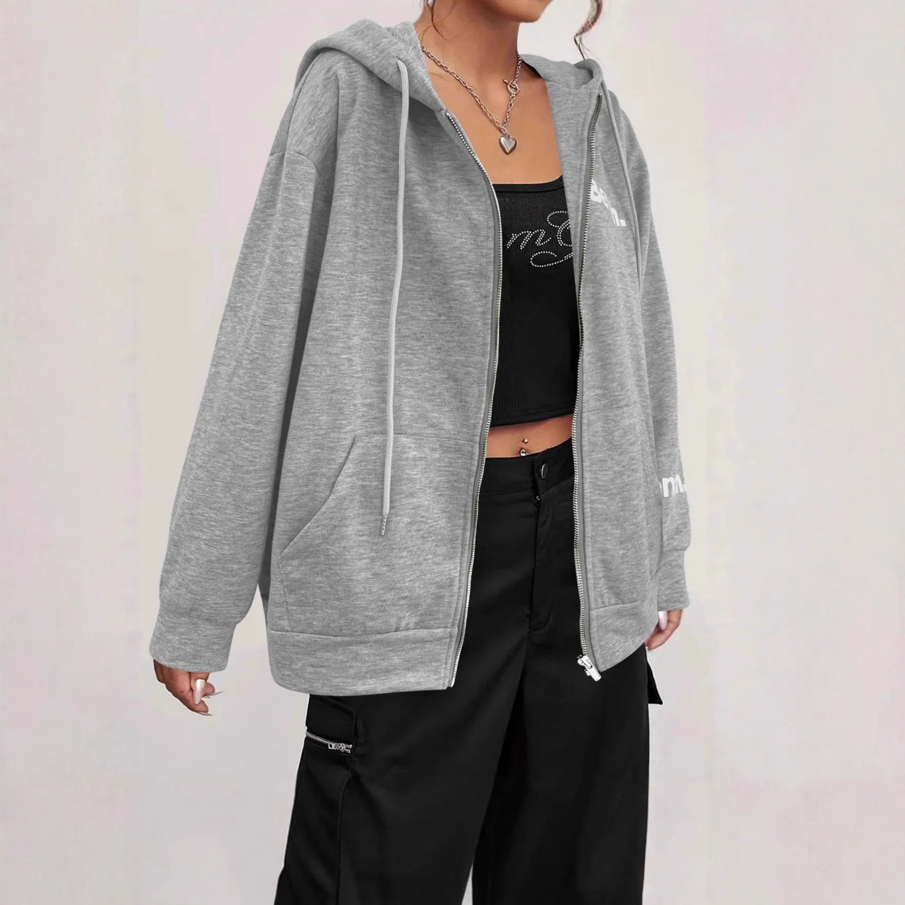 A black loose-fit zipper hooded sweater coat on a hanger, showing the full front zipper and hood.