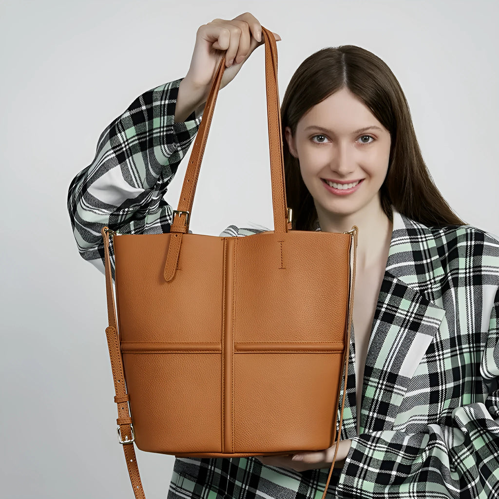 First layer cowhide bucket crossbody bag in black or golden brown, 26cm x 15cm x 29cm, open pocket, polyester cotton lining.
