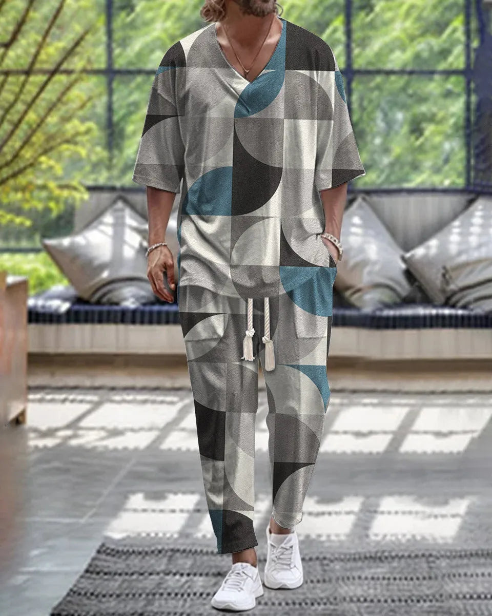 Lightweight cropped sleeve V-neck top and matching trousers suit in a solid colour.