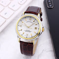 Men's transparent skeleton quartz watch with genuine leather strap on wrist, 37mm dial, alloy case, and stainless steel buckle