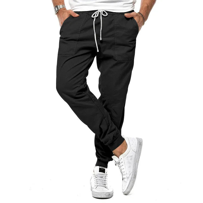 Men's loose tapered casual trousers with drawstring waist and ankle bands in solid colour