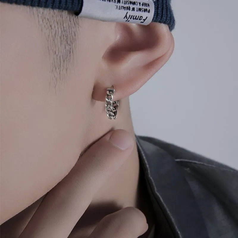 West Coast men's geometric copper earring studs on a plain background, showing silver and patterned options.