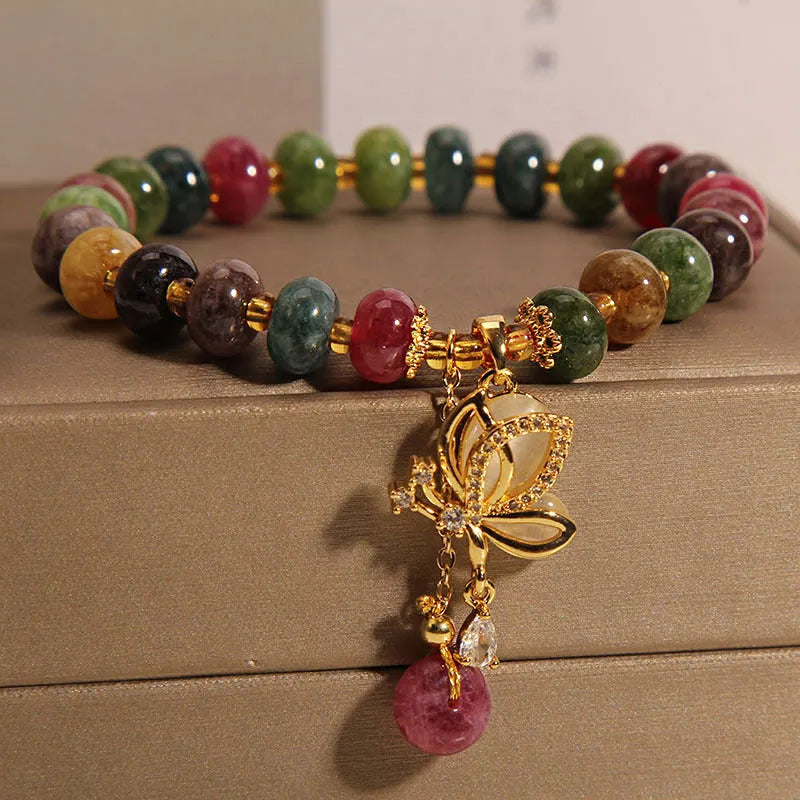 Colourful bead bracelet with alloy butterfly charm for women showing adjustable length