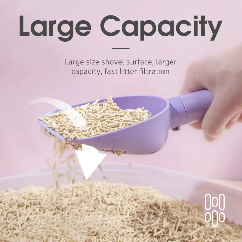 White ABS plastic cat litter scoop with a stand-up base and hidden bag storage compartment.