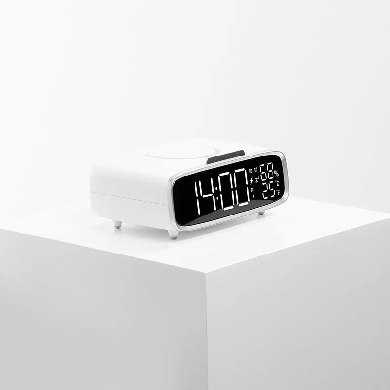 White round Bluetooth speaker wireless charger alarm clock with night light on bedside table