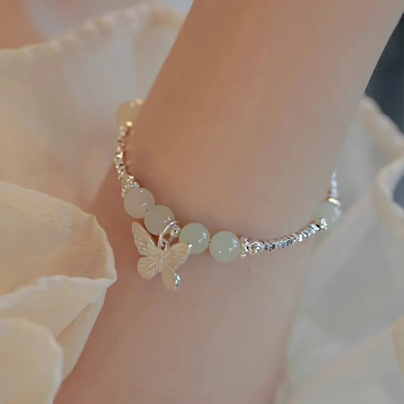 Copper bracelet and necklace set with silver electroplating and butterfly designs featuring Hetian jade accents