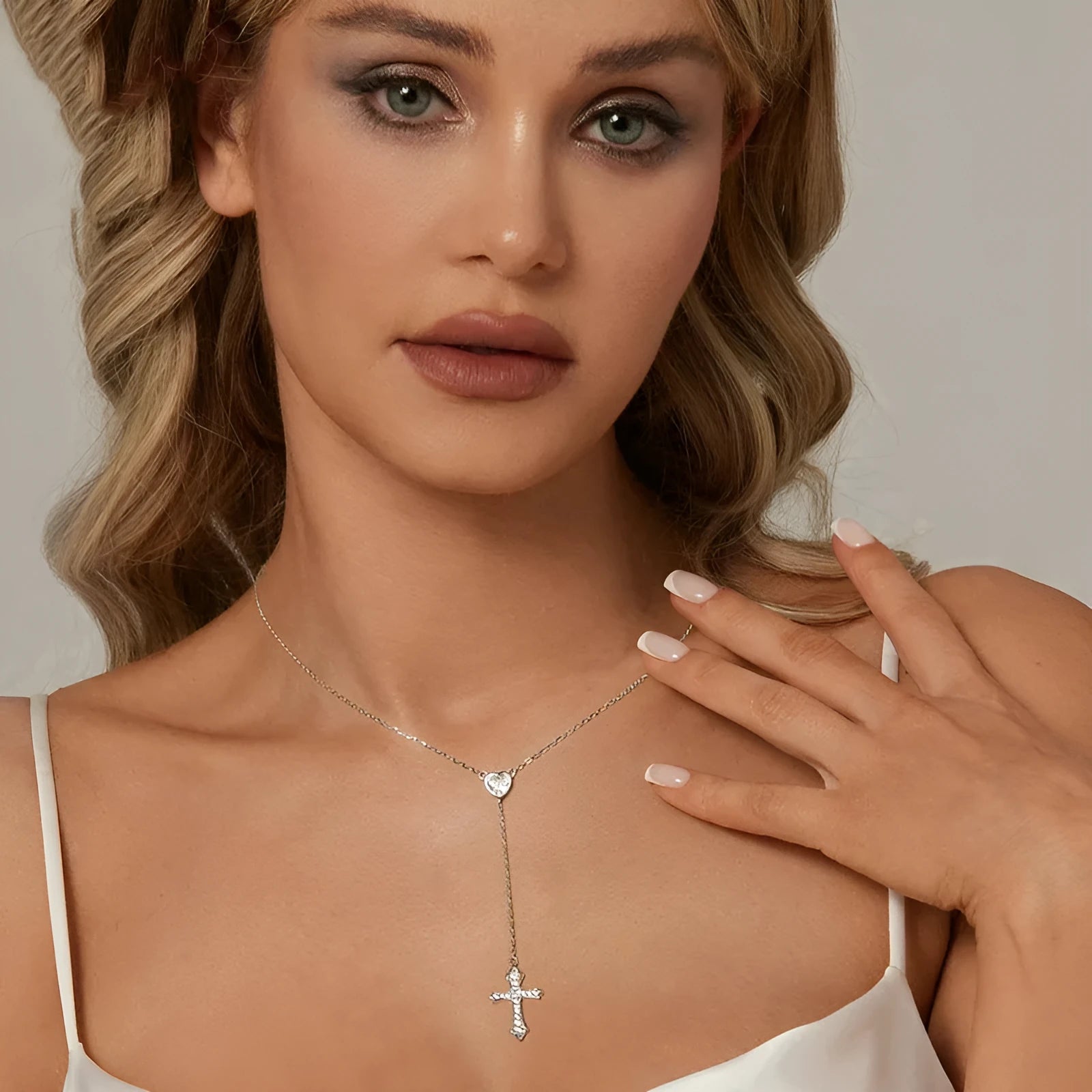 Simple silver cross necklace with V-neck and O-ring chain in colour BSN384.